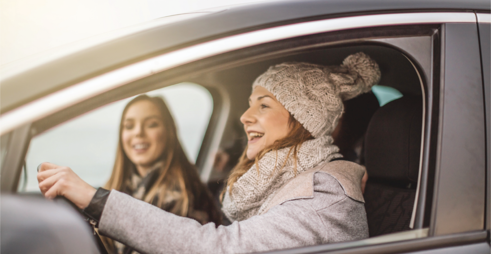 Girl Driving Car With Friend