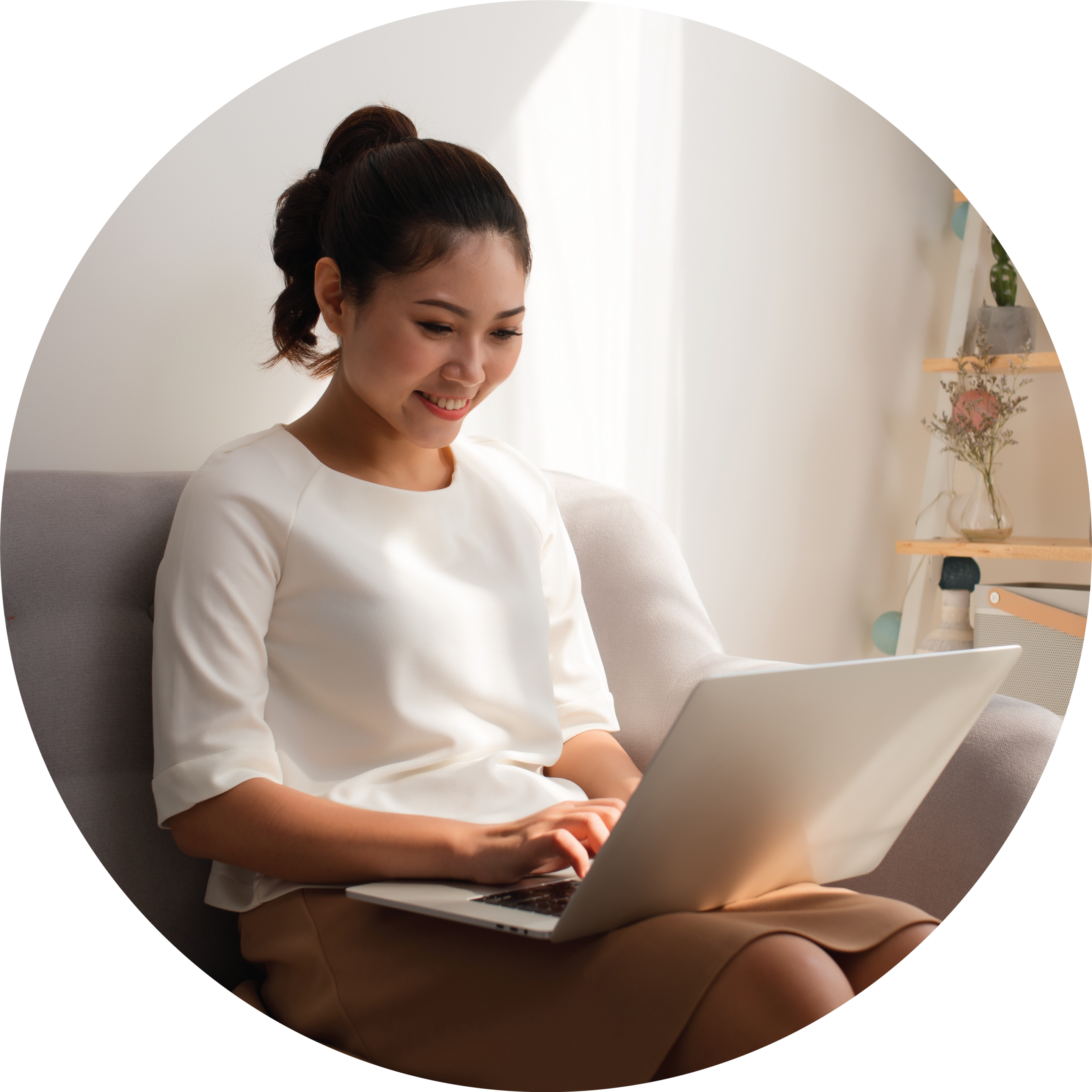 Woman Using Computer On Couch